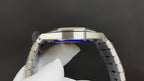 Audemars Piguet watch case side view with brushed metal and blue accent insert