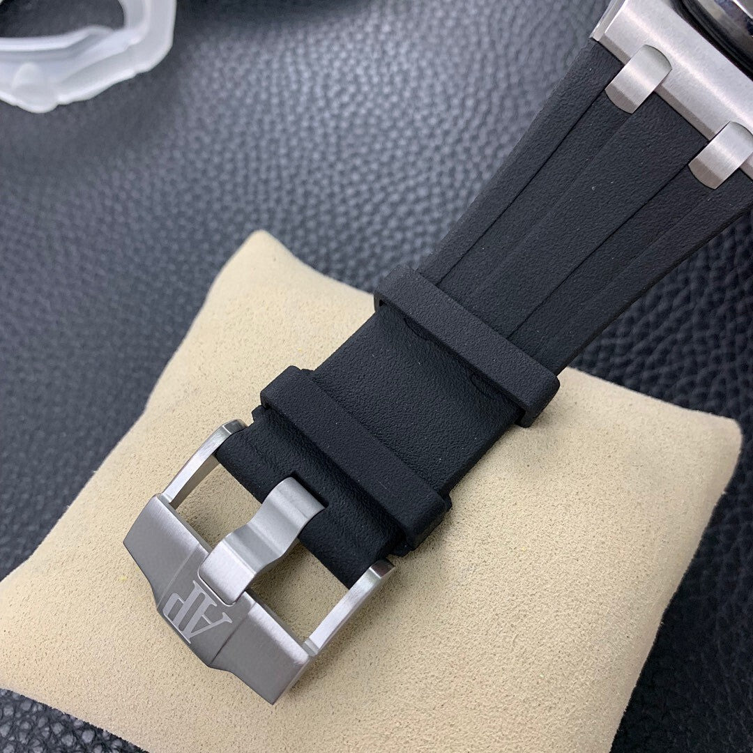 Black rubber watch strap with metal clasp and steel connectors