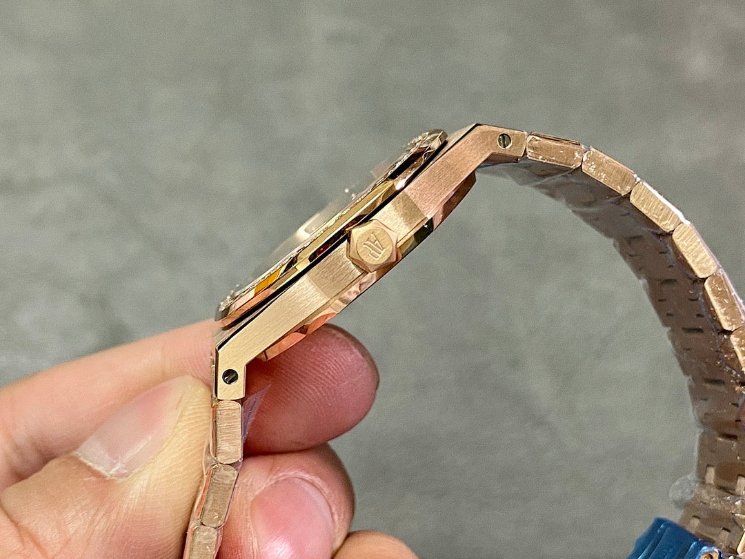 Gold-tone watch side view with crown and metal bracelet links