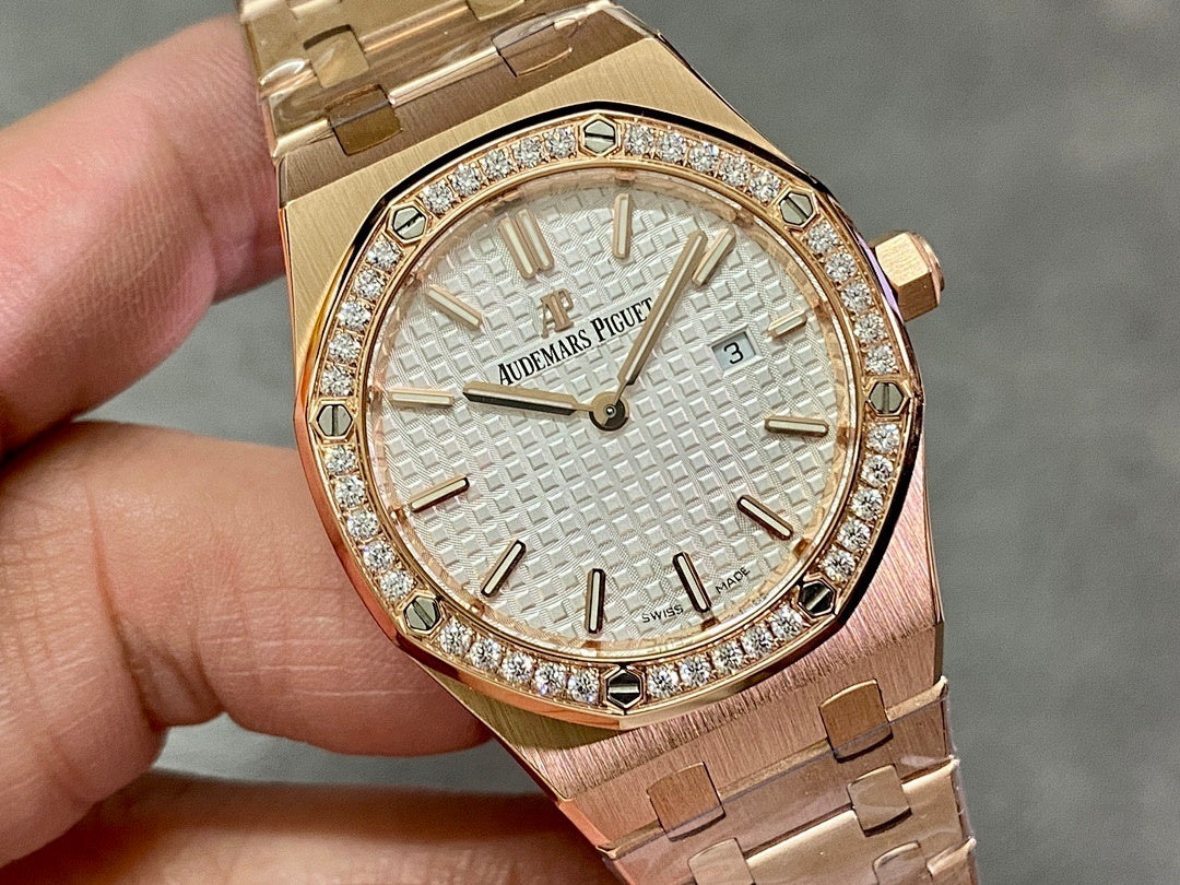 Gold-tone wristwatch close-up with textured dial, diamond bezel, and date display