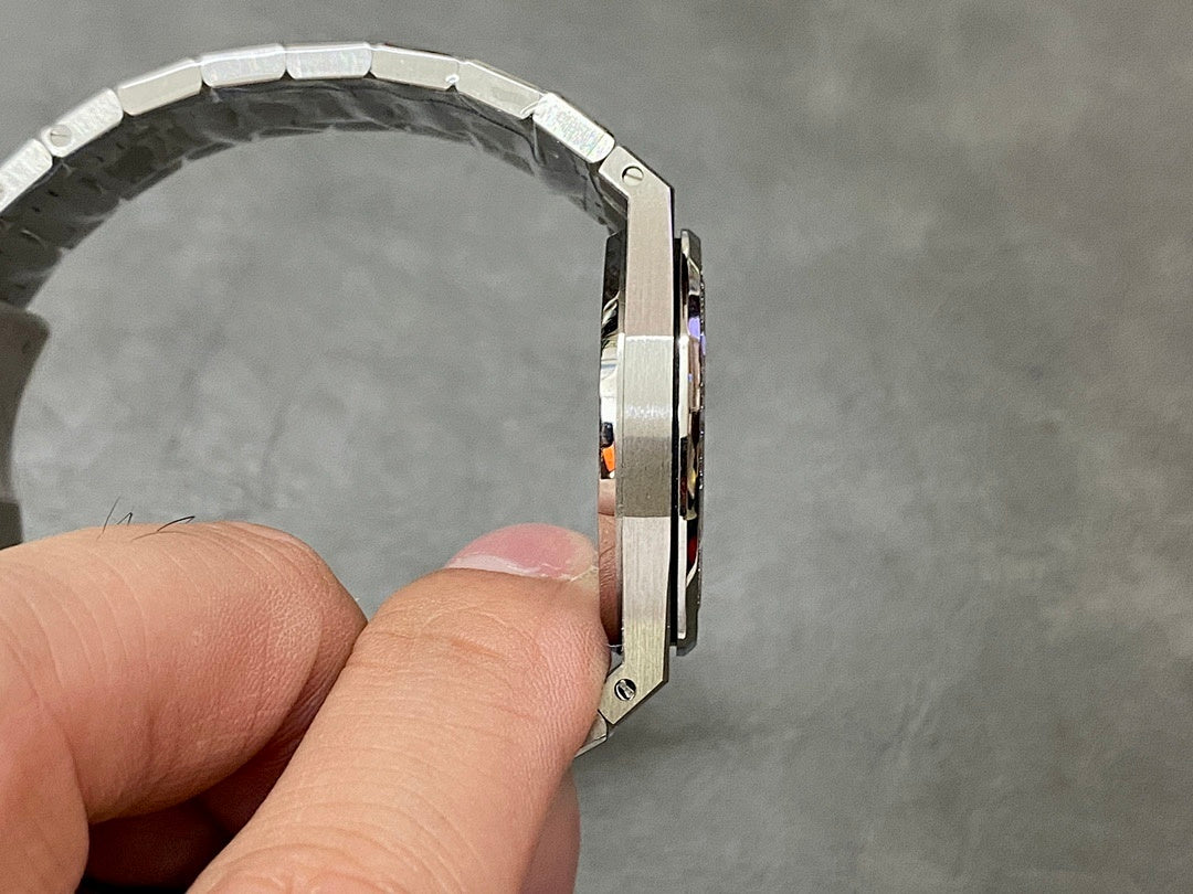 Luxury steel watch case side view with bracelet and clasp edge
