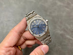 Luxury steel wristwatch with blue textured dial and diamond bezel