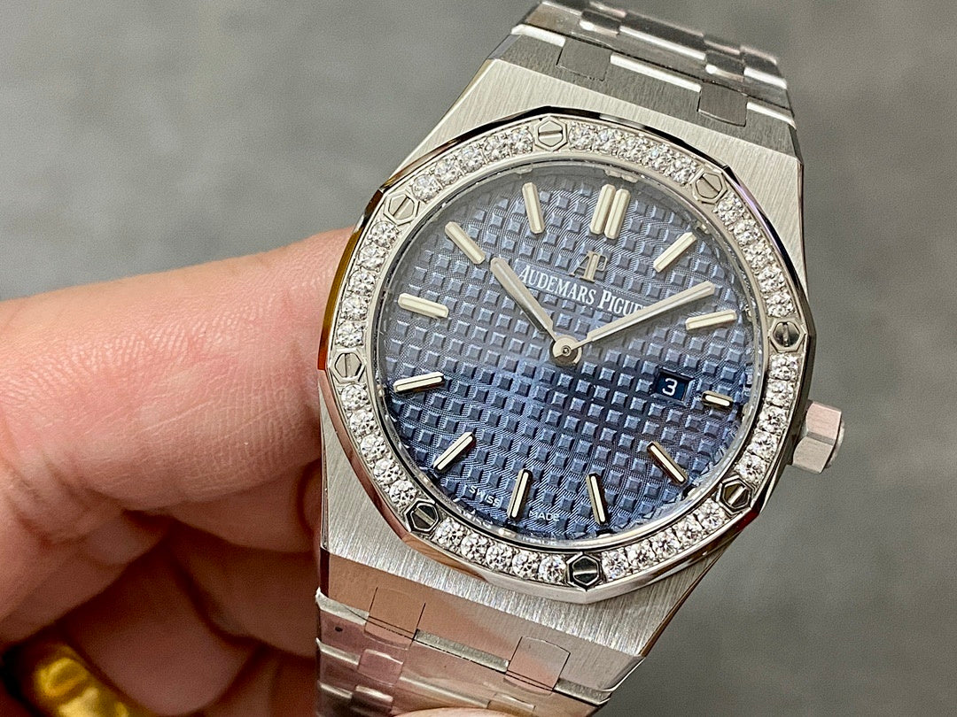 Luxury steel wristwatch with blue textured dial and diamond-set bezel