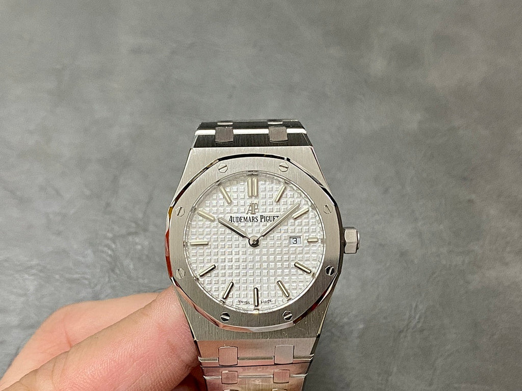 Audemars Piguet Royal Oak wristwatch with stainless bracelet and white dial, baton markers