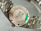 Audemars Piguet watch caseback with engraving and green accent window