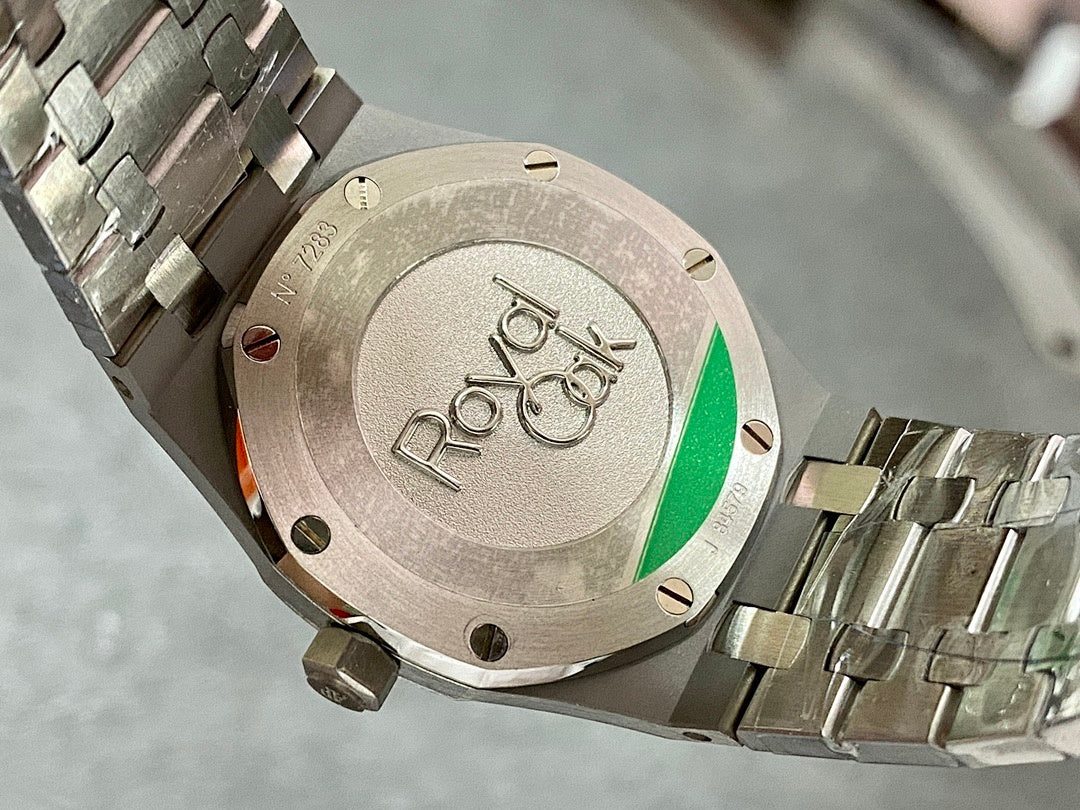 Audemars Piguet watch caseback with engraving and green accent window