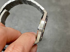 Audemars Piguet Royal Oak watch side profile with brushed metal bracelet