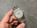 Audemars Piguet Royal Oak wristwatch with light dial, gold-tone hands and baton indices