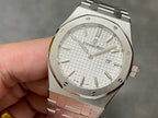 Audemars Piguet Royal Oak wristwatch with white textured dial and gold-tone hands