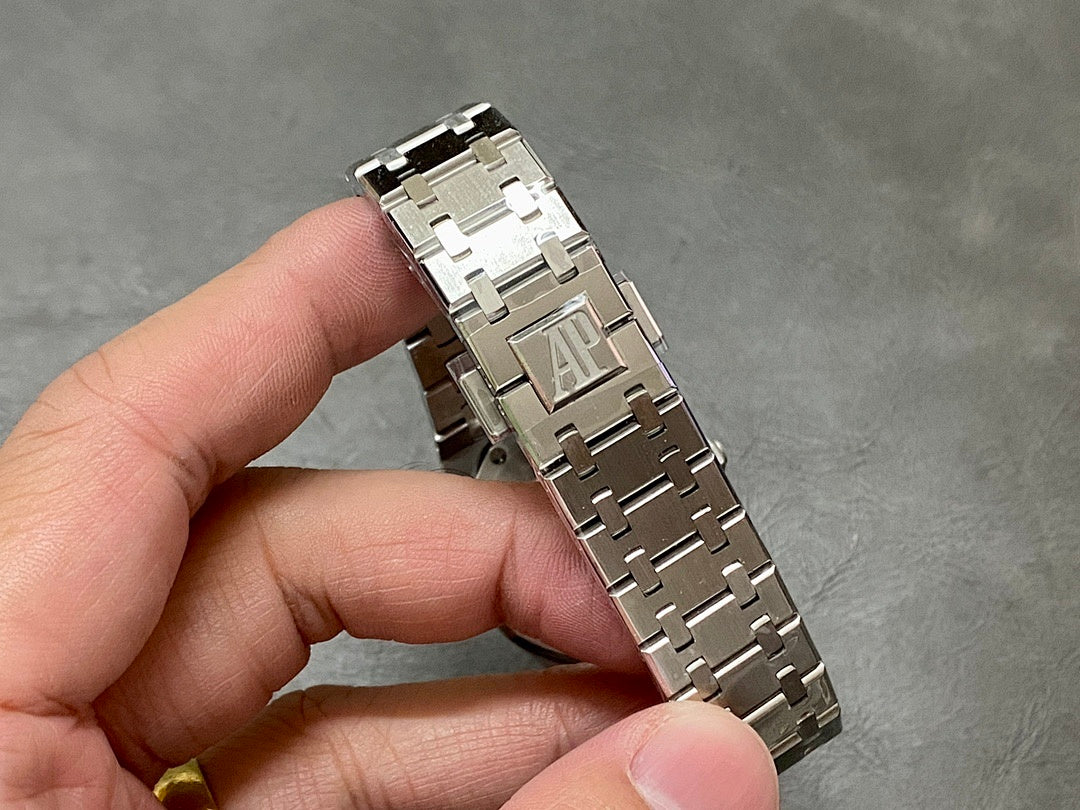 Audemars Piguet watch bracelet clasp with AP logo, steel links and folded closure