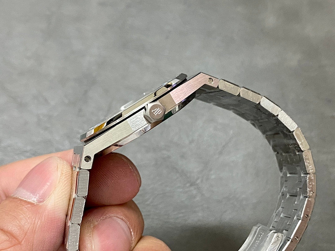 Audemars Piguet watch with steel case side and bracelet, clasp area showing AP emblem