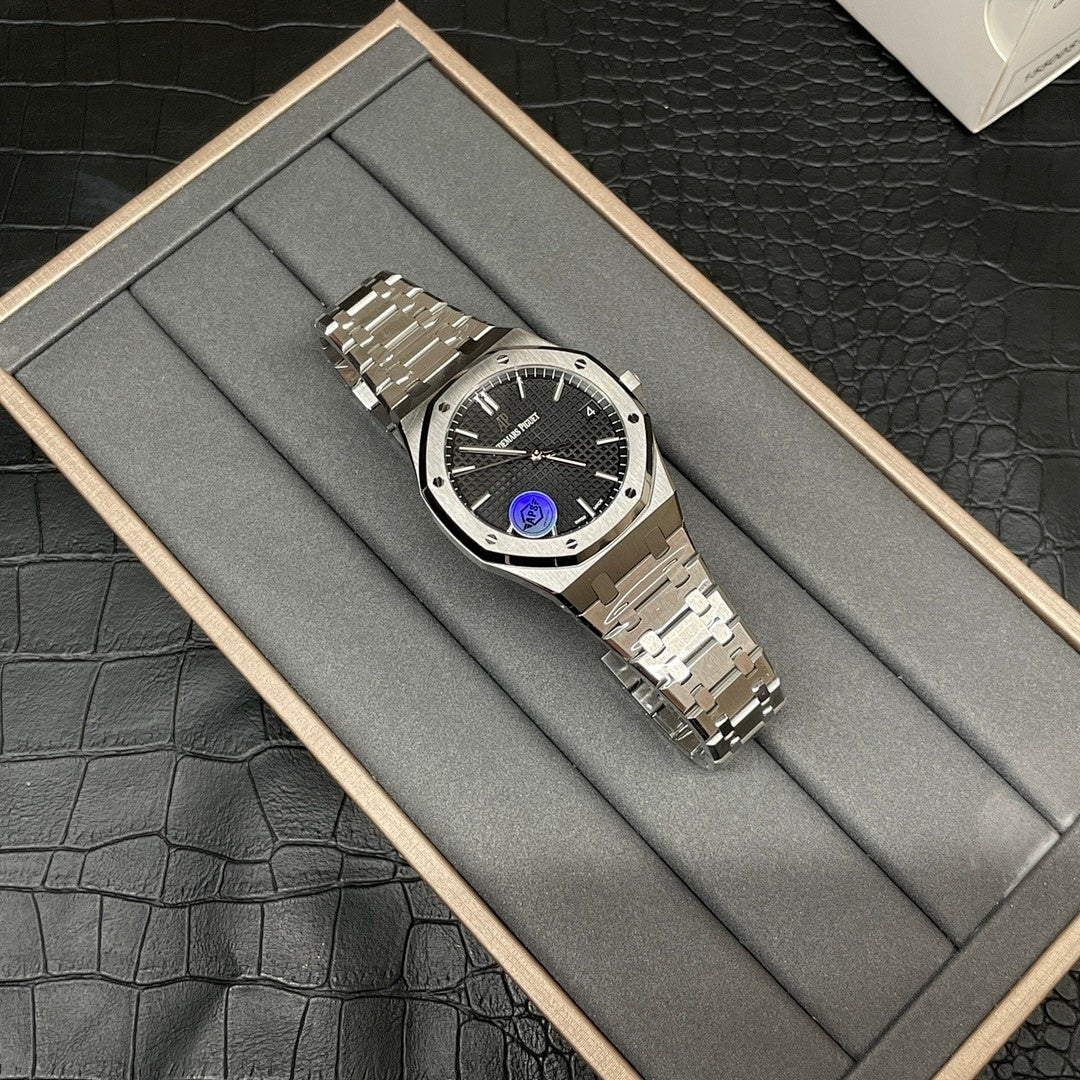 Silver-tone steel wristwatch with black dial, metal bracelet, angled side view