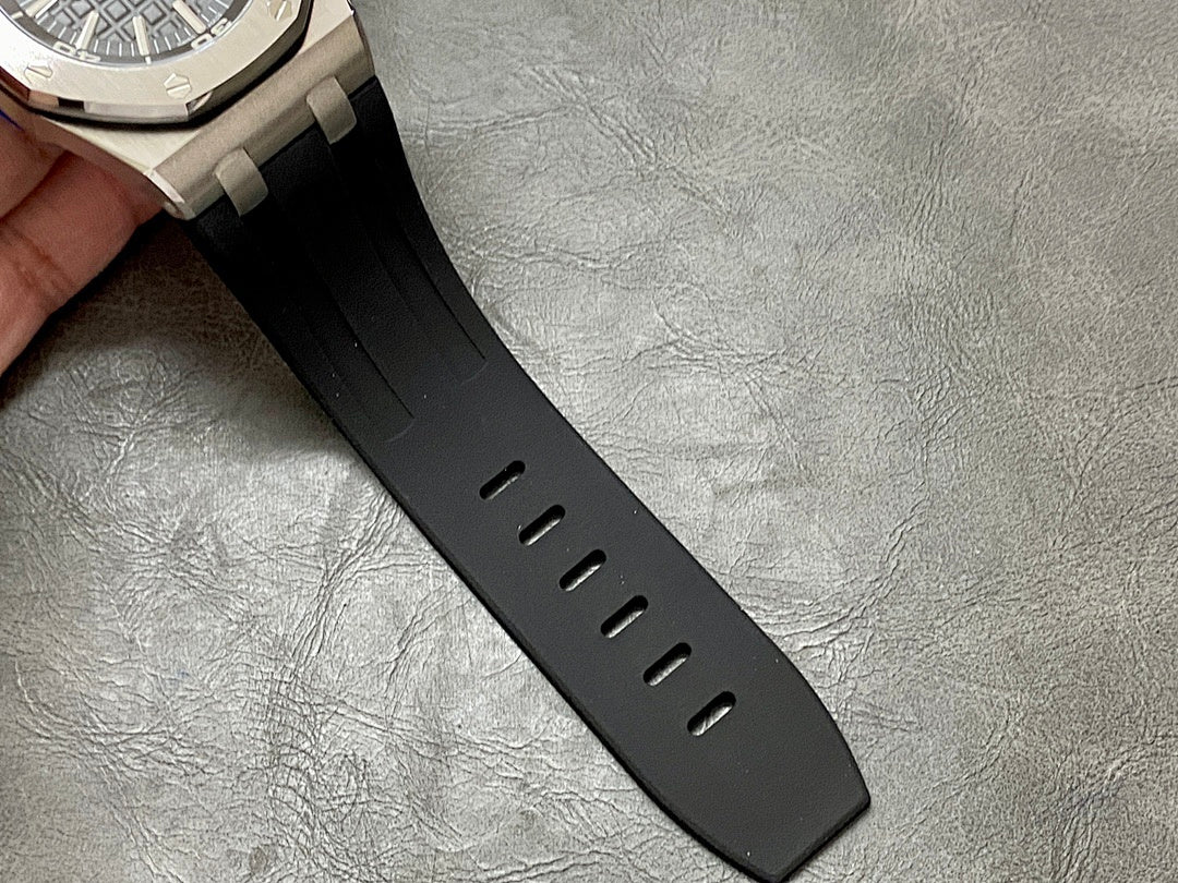 Black rubber watch strap with vent holes along the side