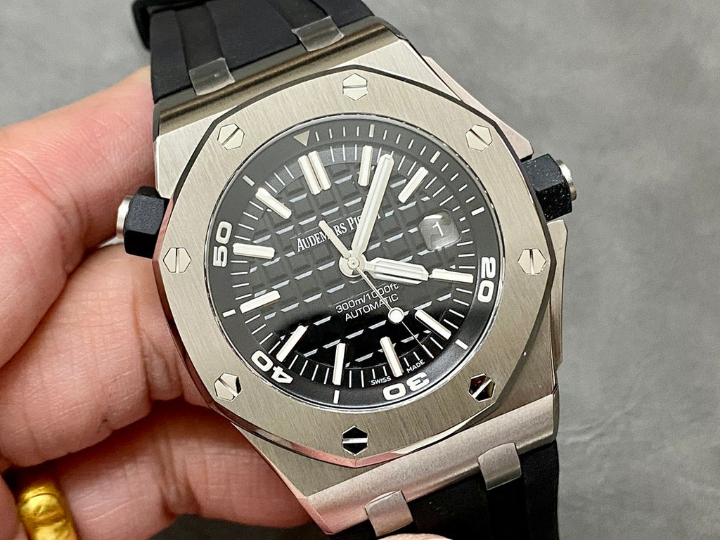 Stainless steel sports watch with black dial and black rubber strap
