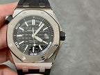 Stainless steel sports watch with black dial and black rubber strap, side view