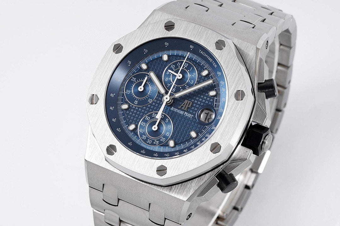 Audemars Piguet Royal Oak watch with blue dial, tachymeter bezel, and steel bracelet