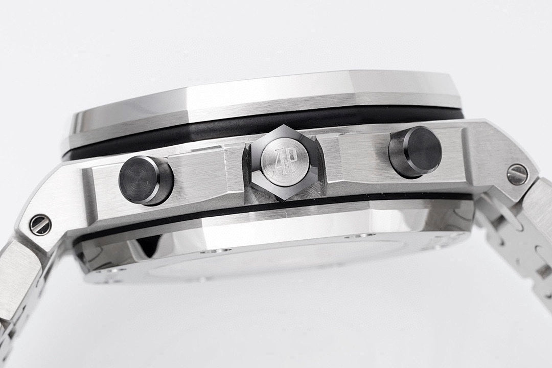 Audemars Piguet watch case closeup with crown and two side pushers