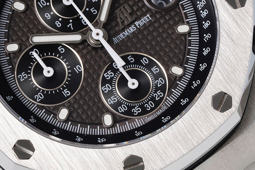 Audemars Piguet watch dial closeup with black tachymeter scale and chronograph hands