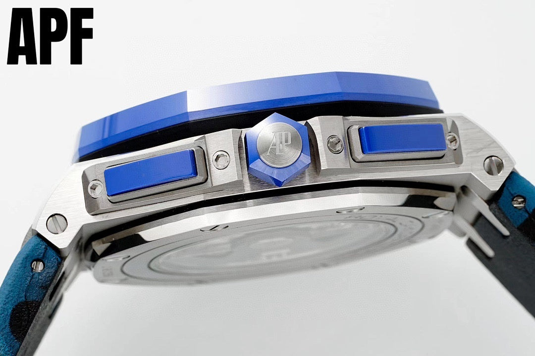Audemars Piguet watch top view, silver case with blue pushers and crown, black strap