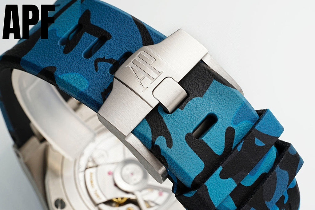Blue camo watch strap with silver buckle clasp and textured fabric, on silver case