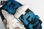 Blue camo watch strap with silver buckle clasp and textured fabric, on silver case