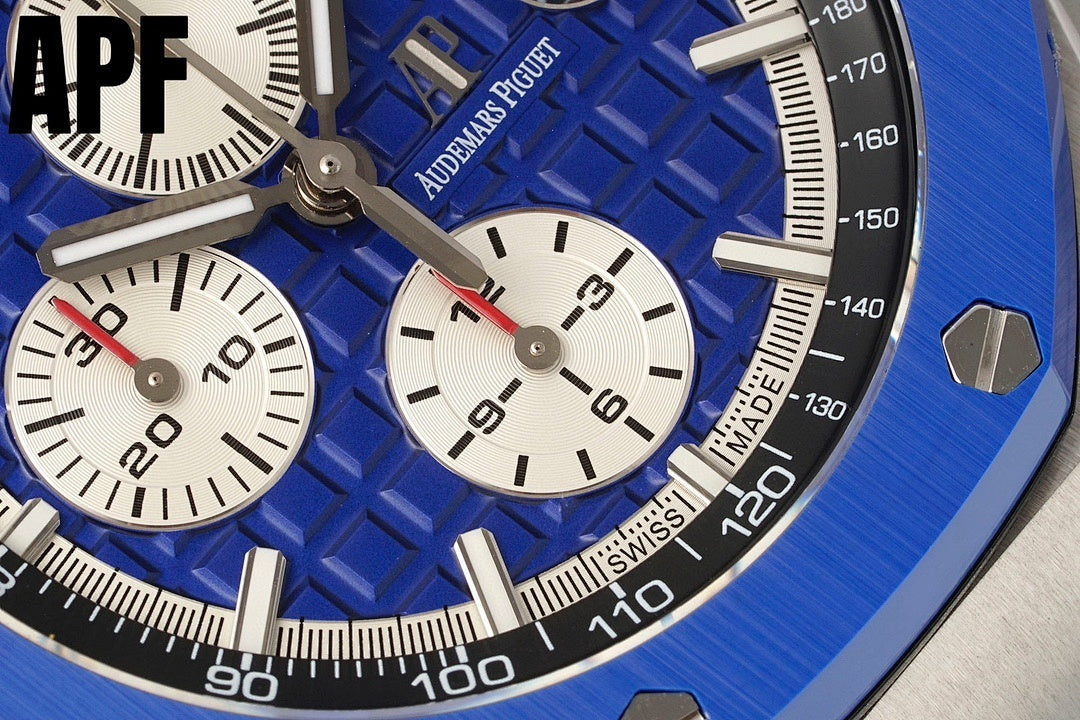 Blue sunburst dial watch with chronograph subdials, white markers, silver hands, bezel