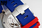 Silicone watch strap close-up with blue rubber, red underside, and steel buckle