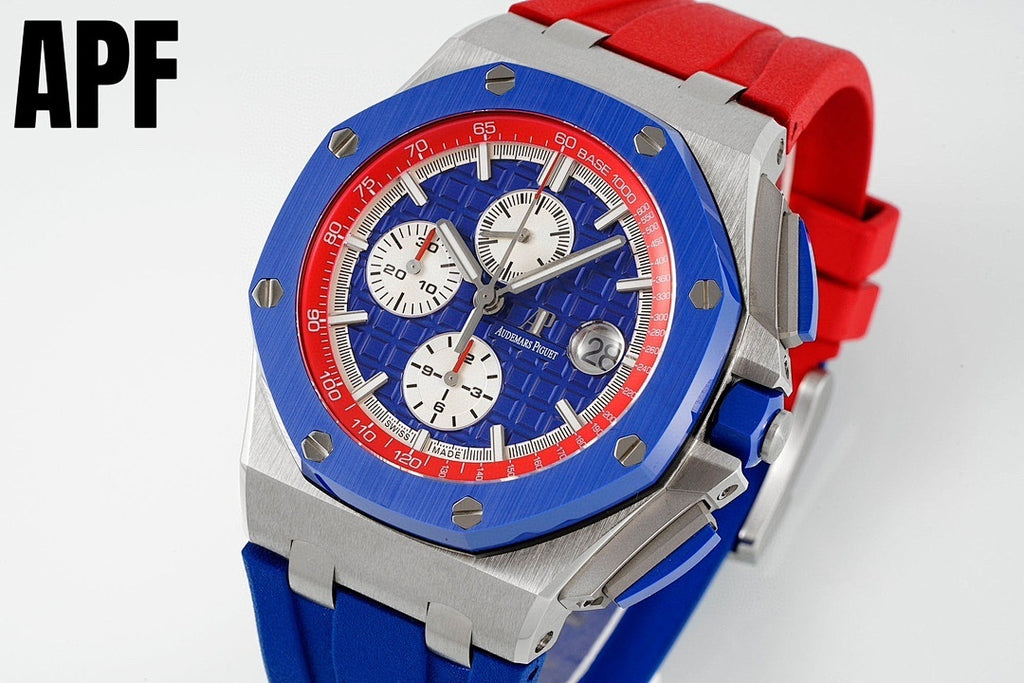 Sports watch with blue dial, red bezel, steel case, and red-and-blue silicone strap