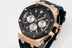 Audemars Piguet watch angled front, black dial, rose-gold case, black rubber strap.