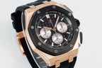 Audemars Piguet watch angled front view, black dial with white subdials, rose-gold bezel.