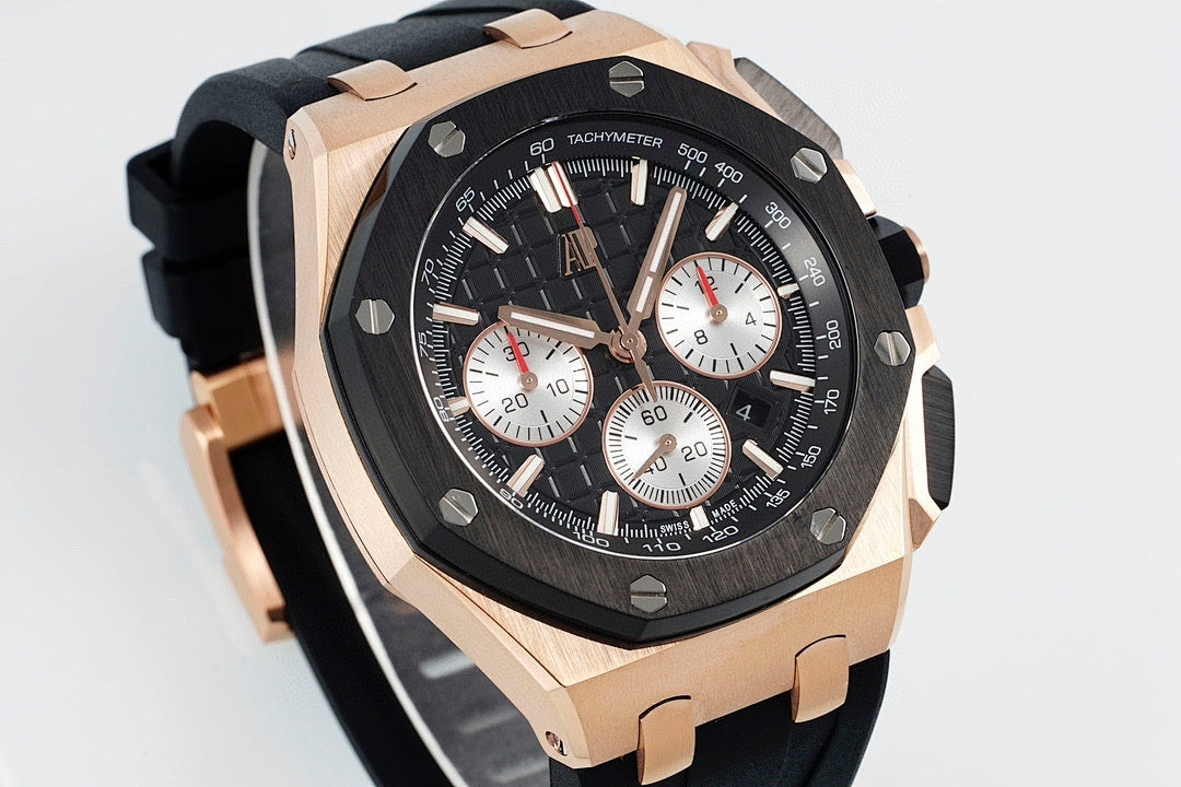 Audemars Piguet watch angled front view, black dial with white subdials, rose-gold bezel.