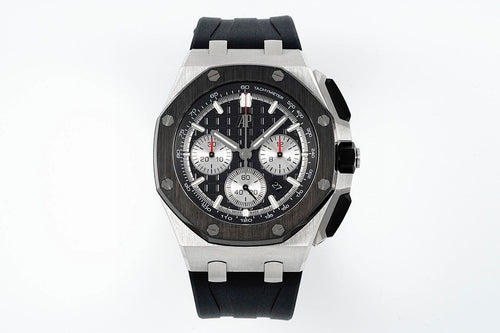 Audemars Piguet chronograph watch with black dial, three subdials, and black rubber strap
