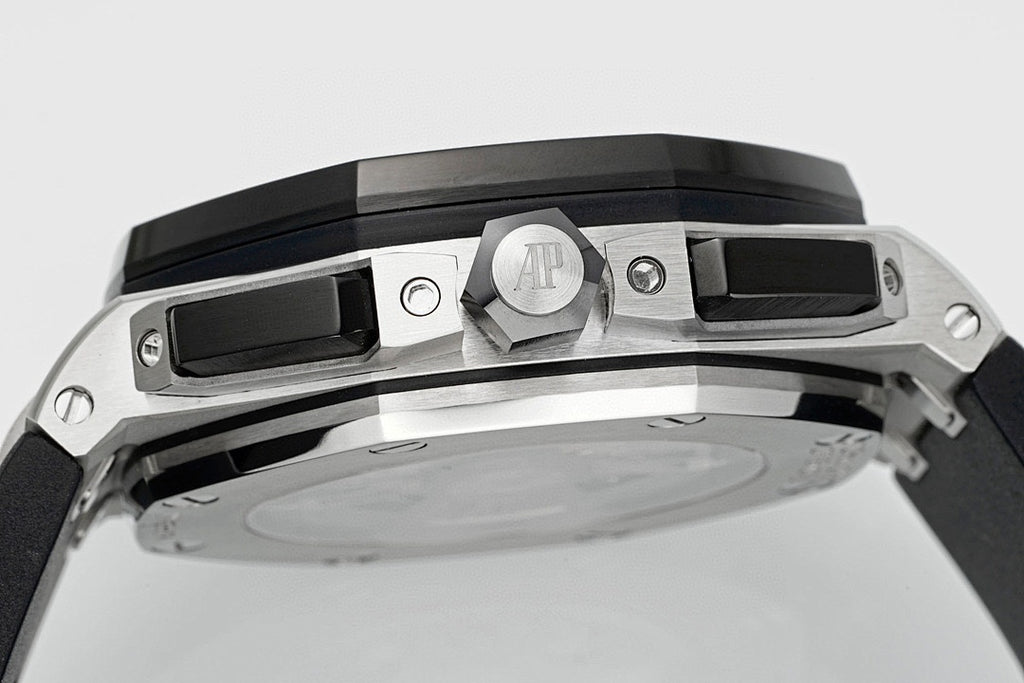 Audemars Piguet watch top view with AP logo bridge and black bezel around the dial