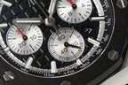 Audemars Piguet chronograph dial close-up with black subdials and red-accent hands