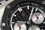 Audemars Piguet tachymeter bezel close-up with red-highlight markers and white dial subviews
