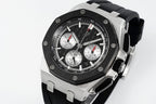 Audemars Piguet chronograph watch angled view with black dial and black rubber strap