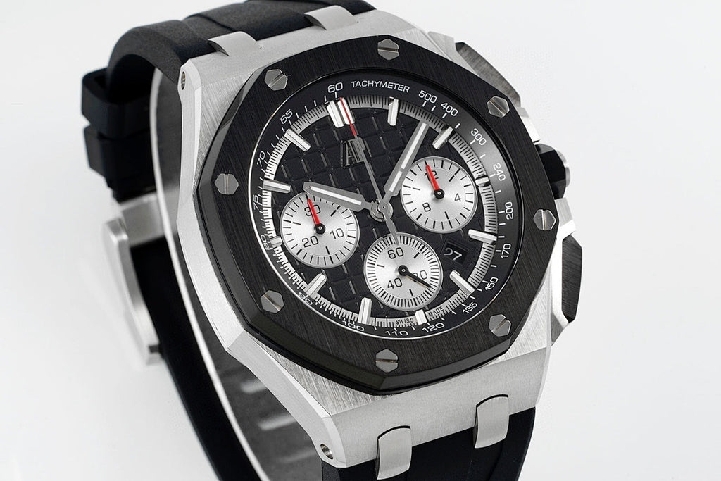 Audemars Piguet chronograph watch three-quarter view with black dial and metal bezel