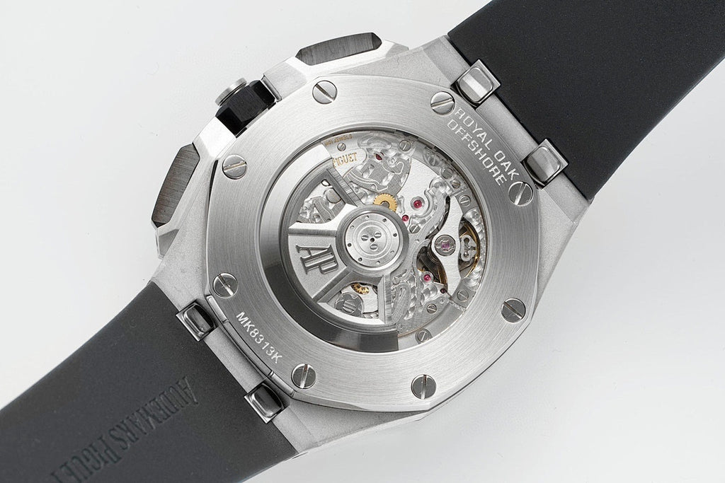 Audemars Piguet Royal Oak caseback, open sapphire window showing mechanical movement, steel case