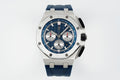 Audemars Piguet blue dial chronograph watch with steel bezel and blue rubber strap
