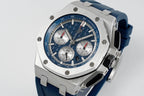 Audemars Piguet blue dial chronograph wristwatch angled with steel case and blue rubber strap
