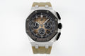 Audemars Piguet sports watch with black dial, three subdials, tan rubber strap