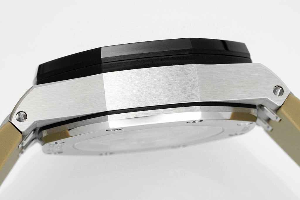 Sports watch with silver case and black bezel, close-up side view