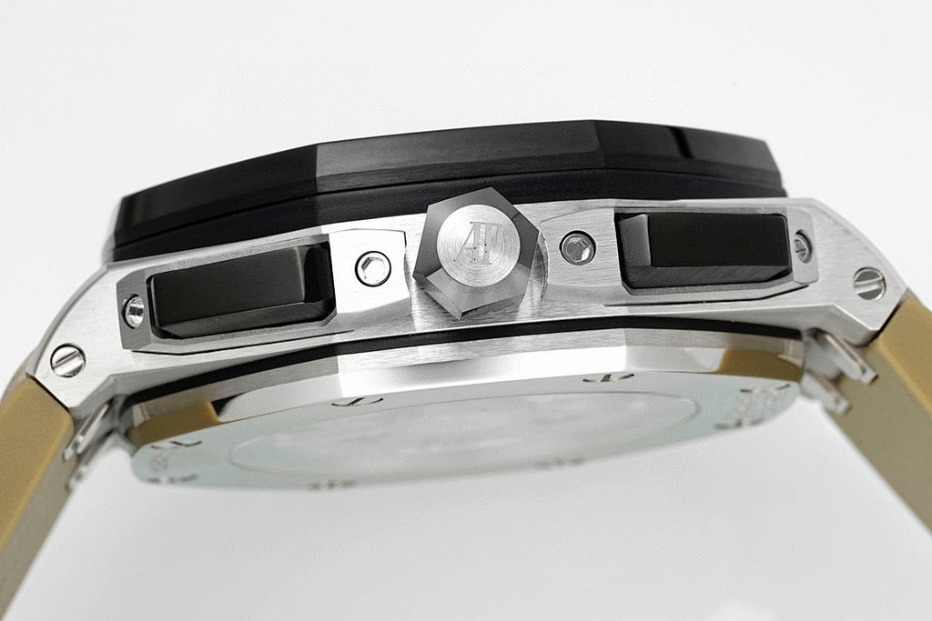 Sports watch case close-up with crown and black top bezel