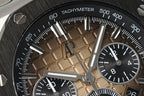 Sports watch dial close-up showing tachymeter scale and subdials