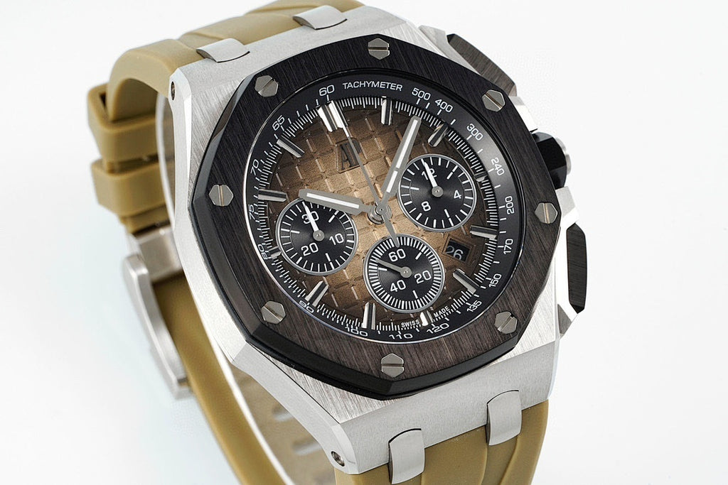 Sports watch with black dial and tan rubber strap, angled view