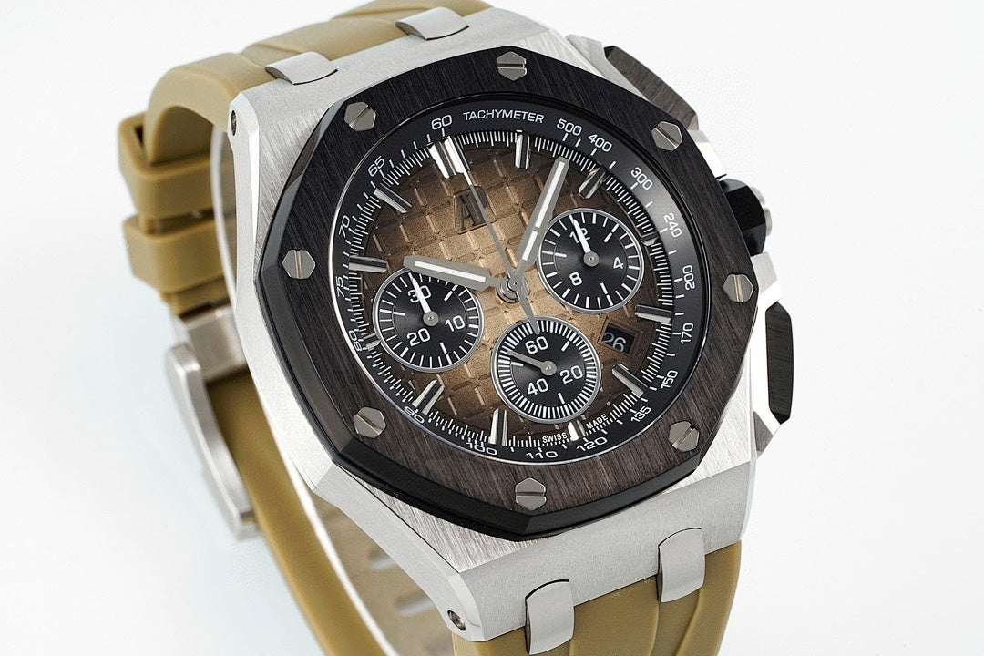 Sports watch with black dial and tan rubber strap, angled view