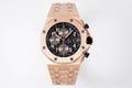 Audemars Piguet rose-gold watch with black chronograph dial and linked bracelet