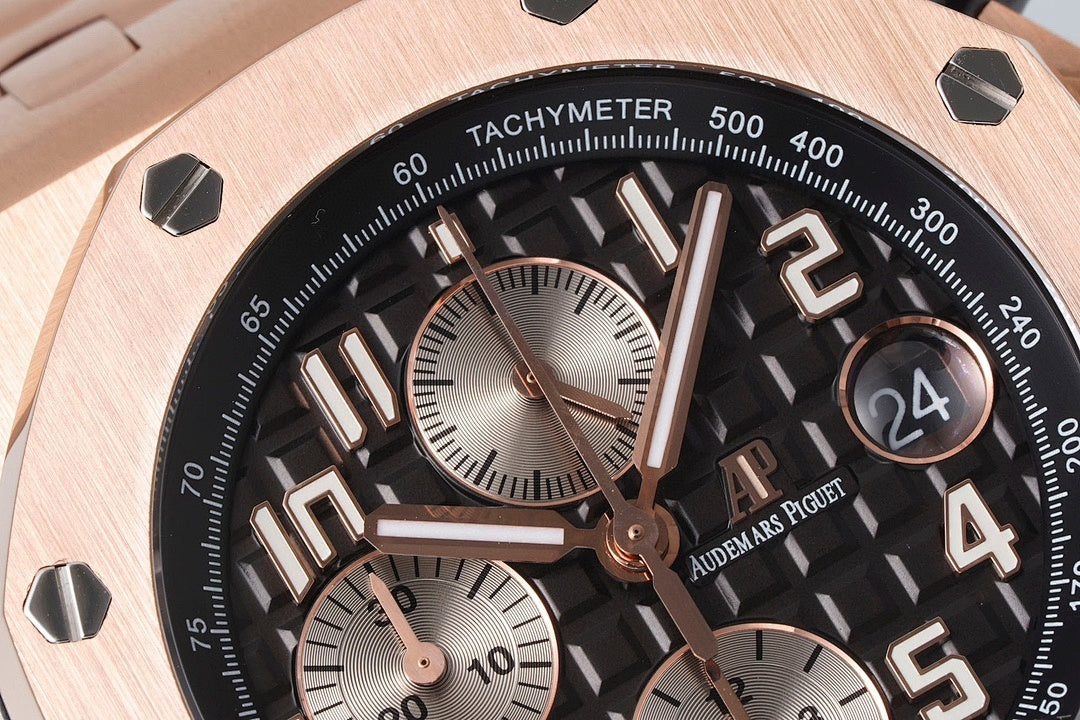 Audemars Piguet rose-gold watch close-up with tachymeter bezel and large numerals