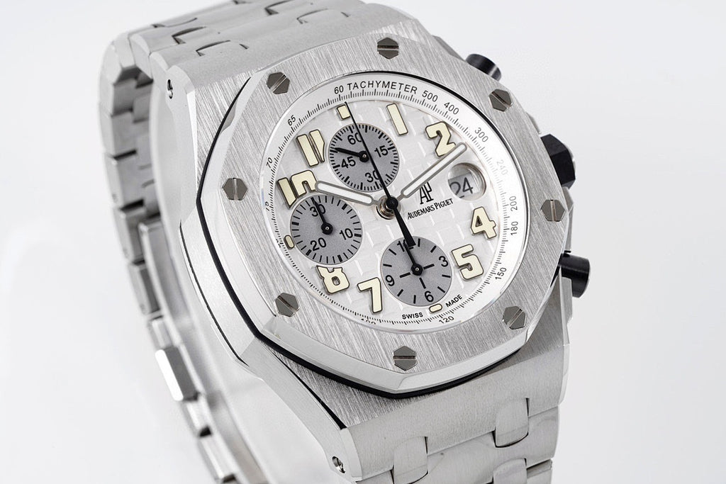 Silver-tone octagonal watch face with pushers and chronograph subdials, angled view