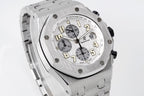 Silver-tone octagonal watch face with pushers and chronograph subdials, angled view